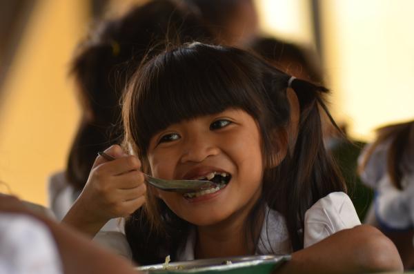 A little girl having lunch in the PSE canteen